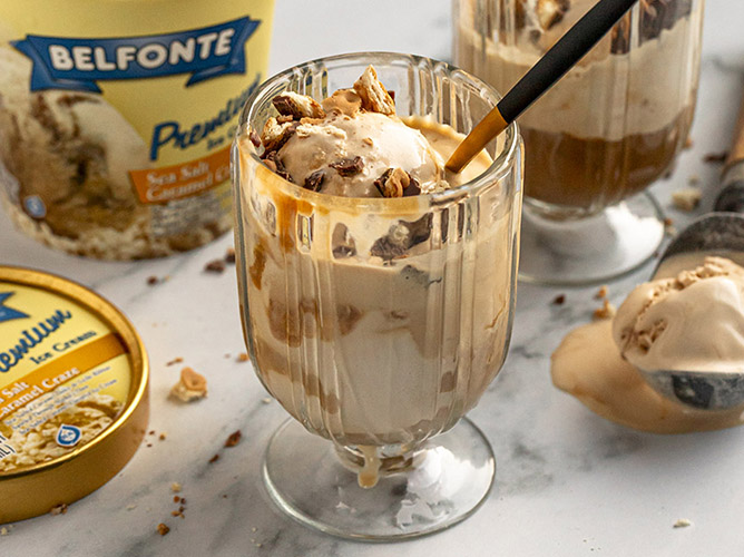 Salted caramel ice cream affogato with espresso, topped with crunchy pecans, served in elegant glass cups for a decadent dessert.